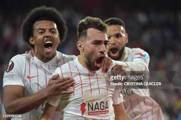 Sevilla's Spanish forward Munir El Haddadi celebrates after scoring a goal during the UEFA Europa League round of 16 first leg football match between...