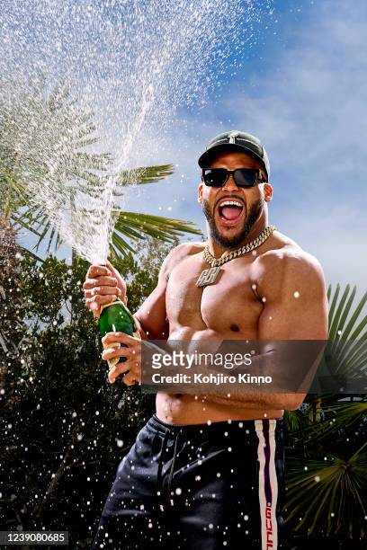 Portrait of Los Angeles Rams defensive tackle Aaron Donald spraying champagne during photo shoot at home. Cover. Calabasas, CA 2/26/2022 CREDIT:...