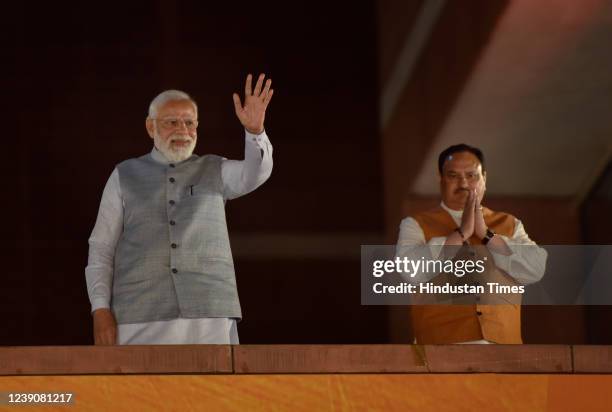 Prime Minister Narendra Modi, along with the party President J P Nadda, gestures at the party workers at Bharatiya Janata Party headquarters during...