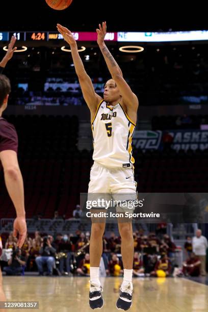 Toledo Rockets guard Ryan Rollins shoots during the second half of the MAC Mens Basketball Tournament Quarterfinal game between the Toledo Rockets...