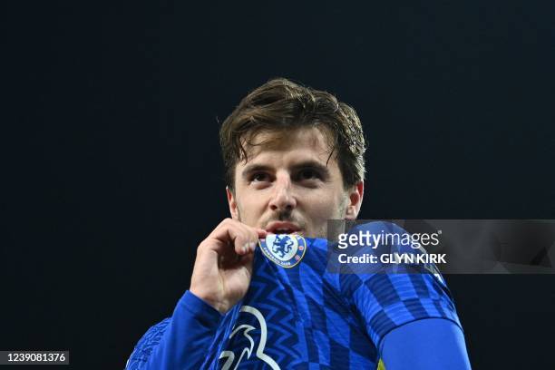 Chelsea's English midfielder Mason Mount kisses the team logo on his jersey as he celebrates after scoring a his team second goal during the English...