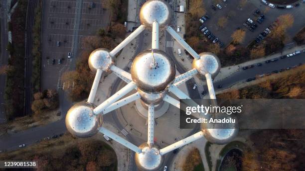 Ukrainian flag is flown at the Atomium monument during a benefit festival held for the people of Ukraine, in Brussels Belgium on March 10, 2022.