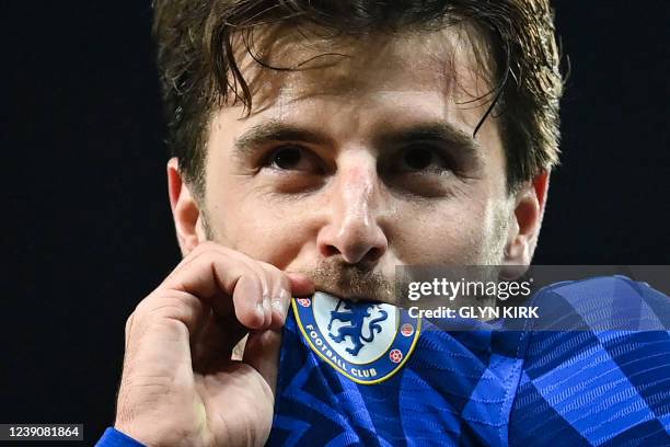 Chelsea's English midfielder Mason Mount kisses the team logo on his jersey as he celebrates after scoring a his team second goal during the English...