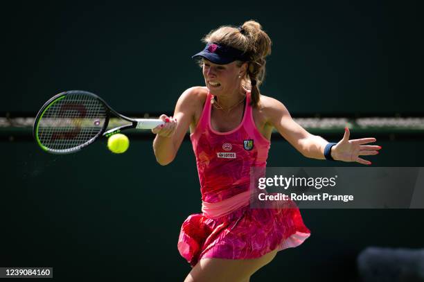 Magdalena Frech of Poland plays a forehand against Mayar Sherif of Egypt in her first round match at the 2022 BNP Paribas Open at the Indian Wells...
