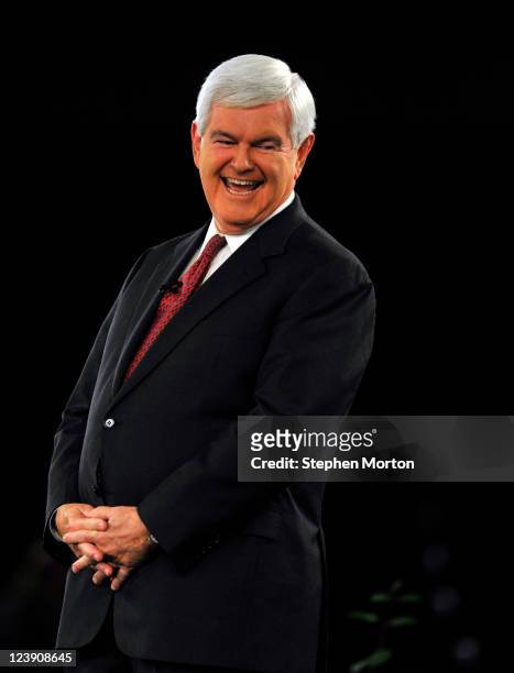 Presidential candidate and former Georgia Congressman Newt Gingrich laughs at a remark during the American Principles Project Palmetto Freedom Forum,...