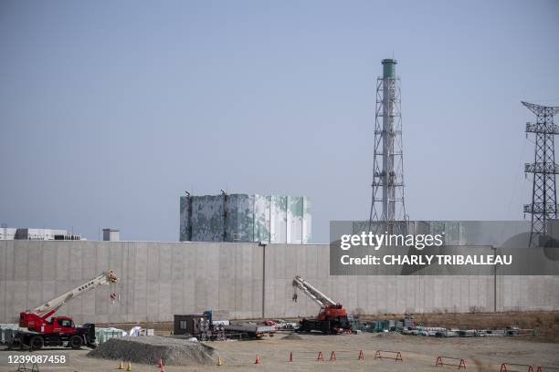 This picture taken on March 5, 2022 shows the irradiated waste storage building and unit 6 and 5 reactor buildings at the Tokyo Electric Power...