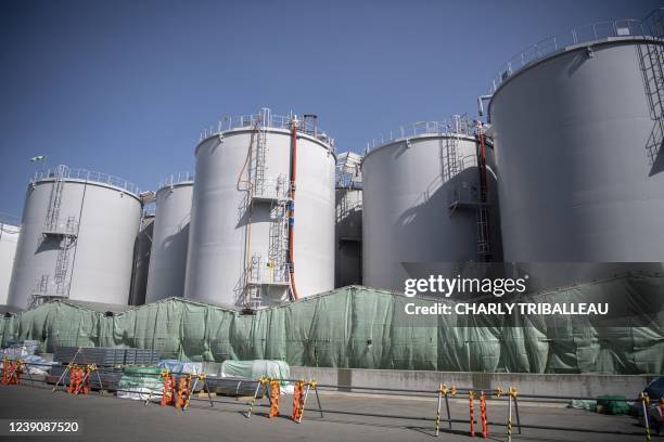 This picture taken on March 5, 2022 shows storage tanks for treated contaminated water at the Tokyo Electric Power Company Fukushima Dai-ichi nuclear...