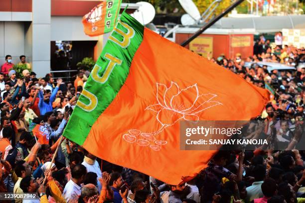 In this picture taken on March 10 supporters of India's Bharatiya Janata Party wave their flag as they celebrate party's win in Uttar Pradesh state...