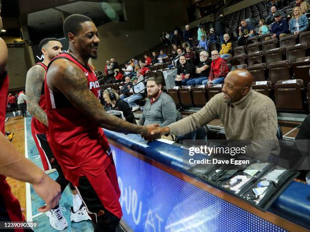 March 10: Mario Chalmers of the Sioux Falls Skyforce shakes hands with Alonzo Mourning, Vice President of Player Programs for the Miami Heat, prior...