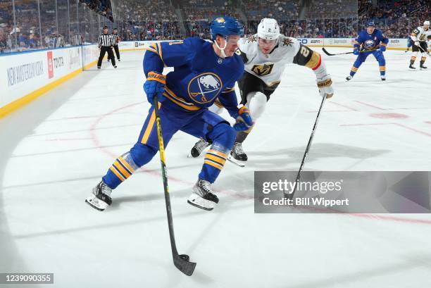 Victor Olofsson of the Buffalo Sabres controls the puck against Zach Whitecloud of the Vegas Golden Knights during an NHL game on March 10, 2022 at...