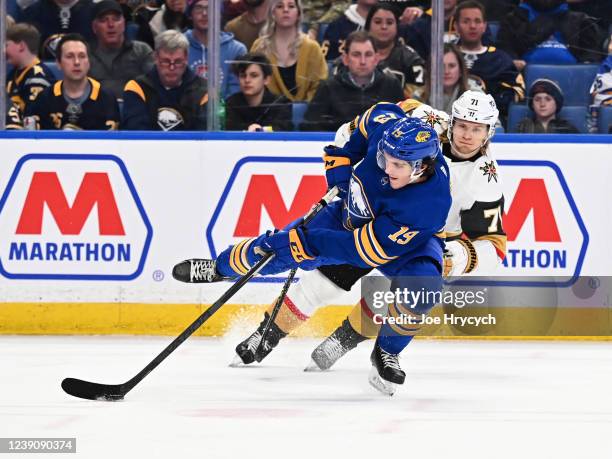 William Karlsson of the Vegas Golden Knights trips Peyton Krebs of the Buffalo Sabres during an NHL game on March 10, 2022 at KeyBank Center in...