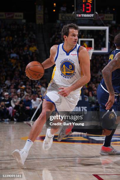 Nemanja Bjelica of the Golden State Warriors drives to the basket during the game against the Denver Nuggets on March 10, 2022 at the Ball Arena in...