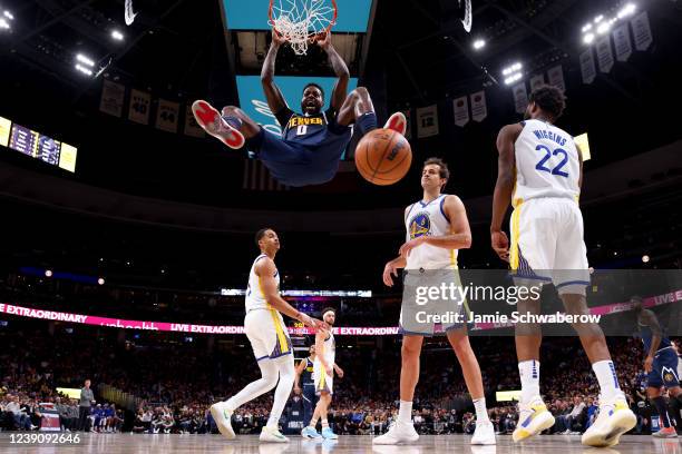 JaMychal Green of the Denver Nuggets dunks against the Golden State Warriors at Ball Arena on March 10, 2022 in Denver, Colorado. NOTE TO USER: User...