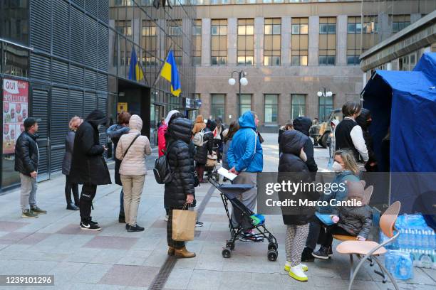 Ukrainian refugees, fleeing the war in their country invaded by Russians, lined up in front of the Ukrainian Consulate in Naples, near a first...