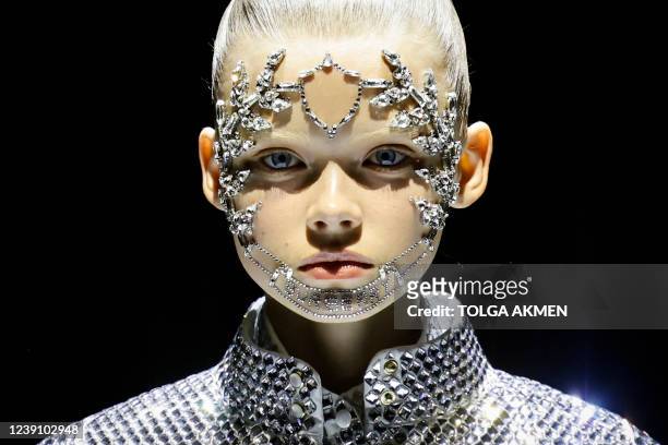 Model presents a creation for Burberry during the Burberry's Fall-Winter 2022 Ready-to-Wear collection fashion show in London, on March 11, 2022.