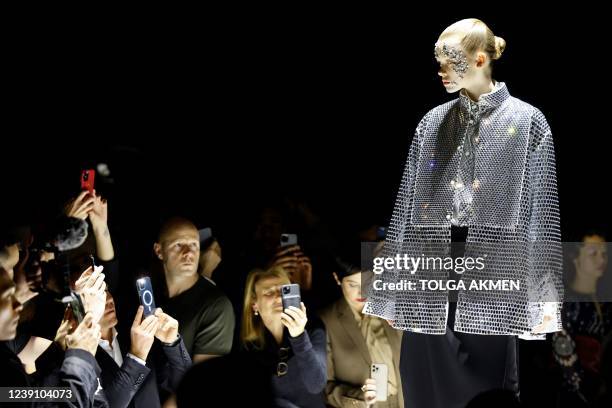 Model presents a creation for Burberry during the Burberry's Fall-Winter 2022 Ready-to-Wear collection fashion show in London, on March 11, 2022.