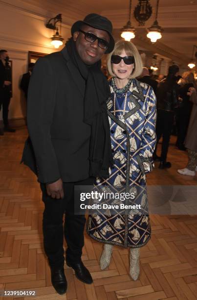 Editor-In-Chief of British Vogue Edward Enninful and Dame Anna Wintour attend the Burberry Autumn/Winter 2022 Runway Show, the brand's first live...