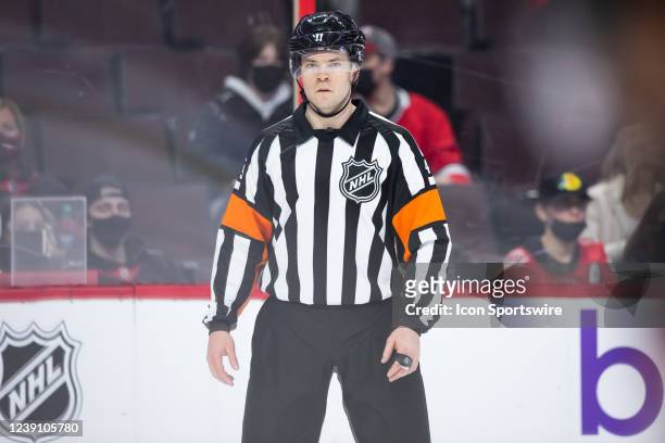 Referee Reid Anderson before a face-off during third period National Hockey League action between the Seattle Kraken and Ottawa Senators on March 10...