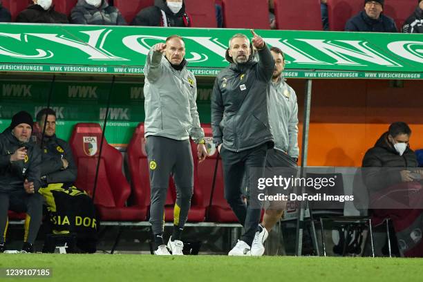 Assistant coach Alexander Zickler of Borussia Dortmund and head coach Marco Rose of Borussia Dortmund gestures during the Bundesliga match between FC...