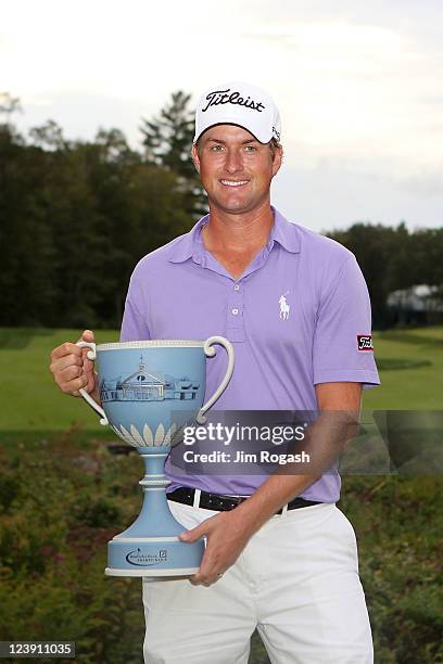 Webb Simpson poses with the trophy after he won thr tournament following the final round of the Deutsche Bank Championship at TPC Boston on September...