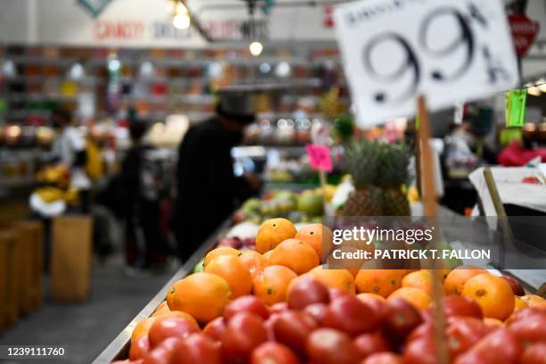 Oranges are displayed at a produce stall inside Grand Central Market on March 11, 2022 in downtown Los Angeles, California. - US consumer prices hit...