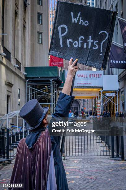 Members of a coalition of healthcare advocacy Participant seen holding a sign at the protest. Community organizations in New York gathered outside...