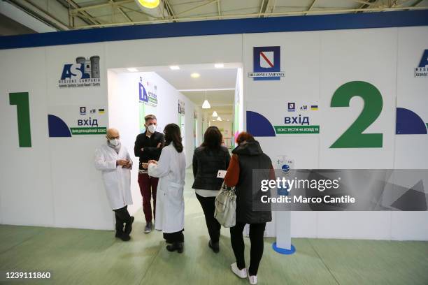 Ukrainian refugees, fleeing their country invaded by Russians, enter the vaccination health center in Naples, to get swabs and vaccination against...