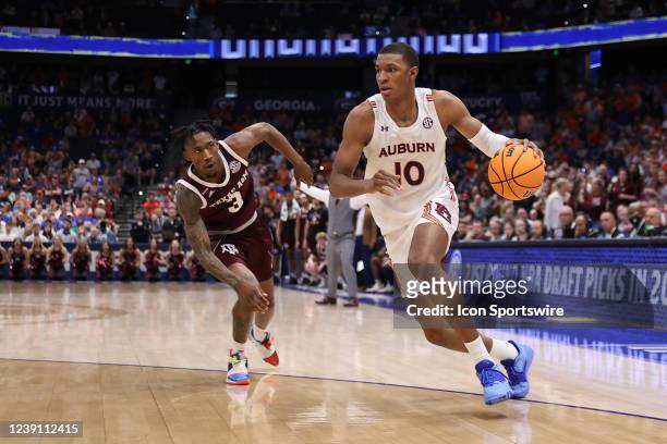 Auburn Tigers forward Jabari Smith drives the ball after getting past Texas A&M Aggies guard Quenton Jackson during the SEC Tournament between the...
