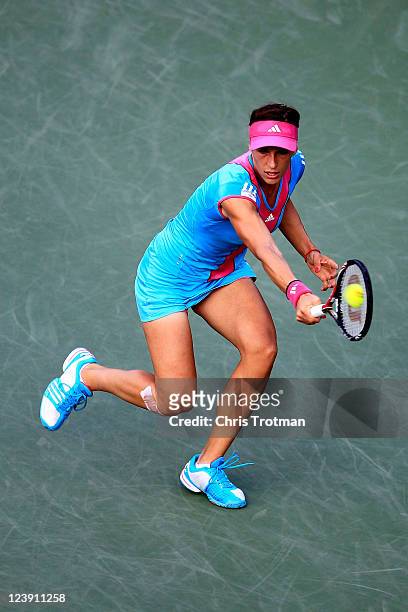 Andrea Petkovic of Germany returns a shot against Carla Suarez Navarro of Spain during Day Eight of the 2011 US Open at the USTA Billie Jean King...