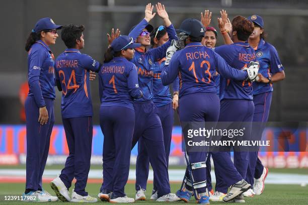 Indian players celebrate the dismissal of West Indies' Kycia Knight during the 2022 Women's Cricket World Cup match between West Indies and India at...