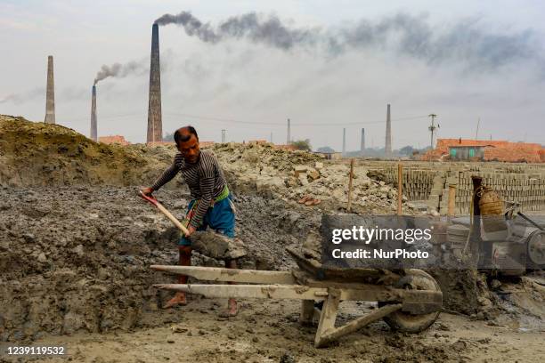 Workers are working at a brickyard in Dhaka, Bangladesh.