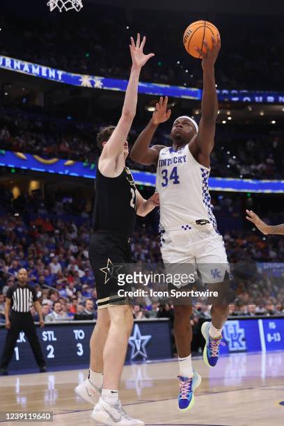 Kentucky Wildcats forward Oscar Tshiebwe goes up strong against Vanderbilt Commodores center Liam Robbins during the SEC Tournament between the...
