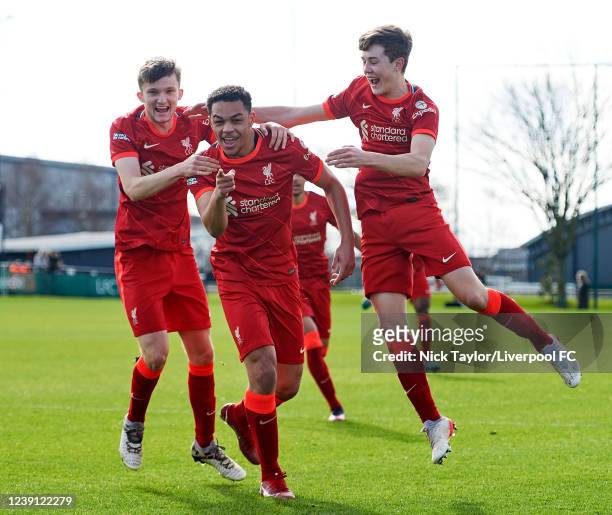 Lee Jonas of Liverpool celebrates scoring Liverpool's first goal with Terence Miles and Tommy Pilling during the game at AXA Training Centre on March...