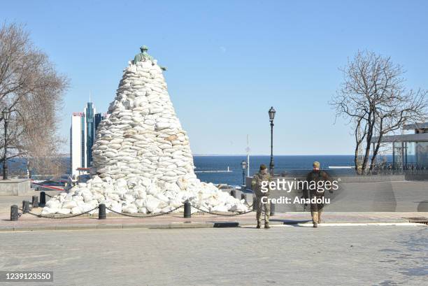 Monument of the city founder Duke de Richelieu is seen covered with sand bags for protection, amid Russian attacks on Ukraine, in central Odessa,...