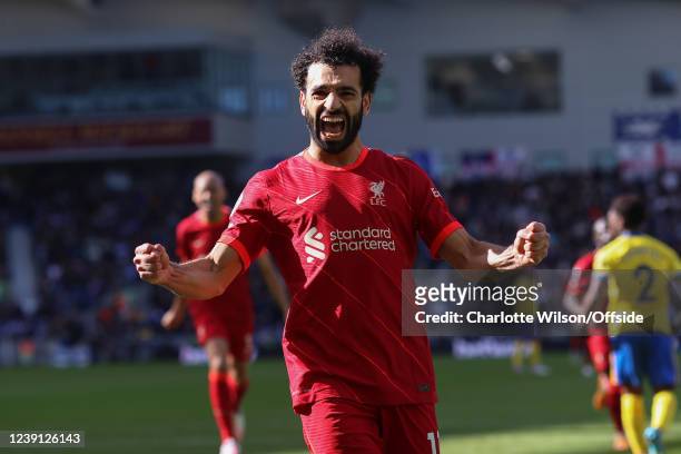 Mohamed Salah of Liverpool celebrates scoring their 2nd goal from the penalty spot during the Premier League match between Brighton & Hove Albion and...