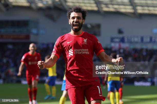 Mohamed Salah of Liverpool celebrates scoring their 2nd goal from the penalty spot during the Premier League match between Brighton & Hove Albion and...