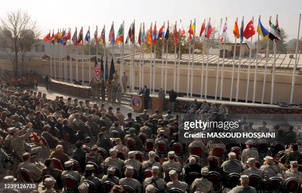 Soldiers listen during a change-of-command ceremony at Camp Egger in Kabul on November 21, 2009. Afghan officials along with NATO soldiers...