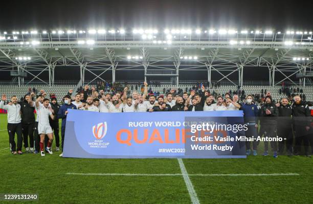 Georgia team celebrates qualifying for the World Cup after the 2022 Rugby Europe Championship match between Romania and Georgia at Arc de Triumf...