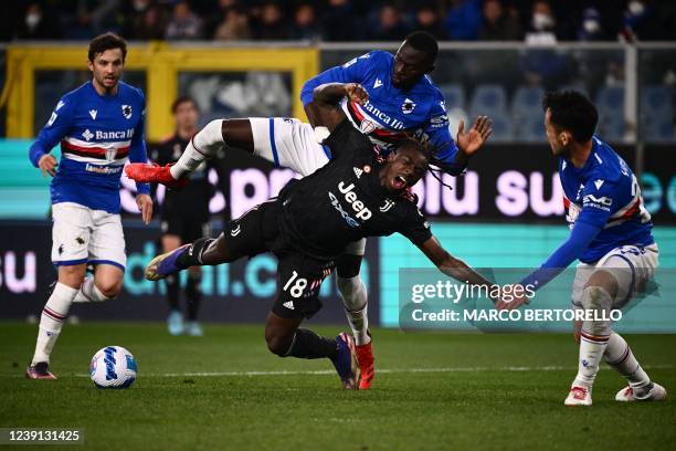 Sampdoria's Gambian defender Omar Colley fouls Juventus' Italian forward Moise Kean in the penalty area during the Italian Serie A football match...