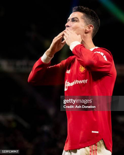 Cristiano Ronaldo of Manchester United celebrates scoring a goal to make the score 3-2 and secure his hat-trick during the Premier League match...