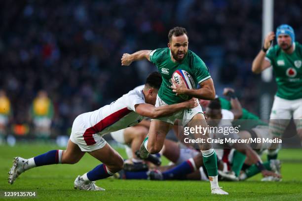 Jamison Gibson-Park of Ireland is tackled by Marcus Smith of England during the Six Nations Rugby match between England and Ireland at Twickenham...