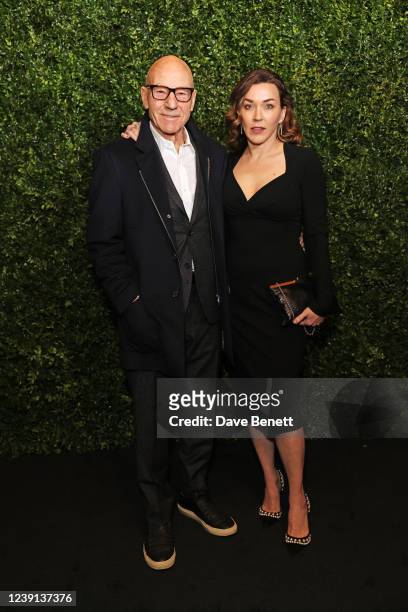 Sir Patrick Stewart and Sunny Ozell arrive at the Charles Finch & CHANEL Pre-BAFTA Party at 5 Hertford Street on March 12, 2022 in London, England.