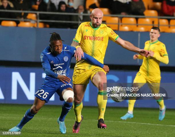 Troyes' forward Lebo Mothiba fights for the ball with Nantes' defender Nicolas Pallois during the French L1 football match between Troyes and Nantes...