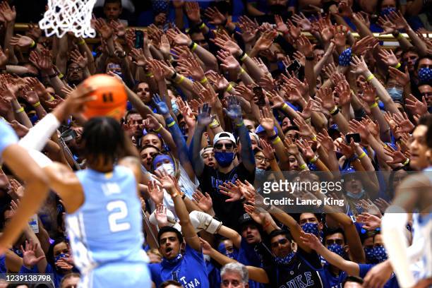 Cameron Crazies and fans of the Duke Blue Devils try to distract Caleb Love of the North Carolina Tar Heels during a free-throw attempt at Cameron...