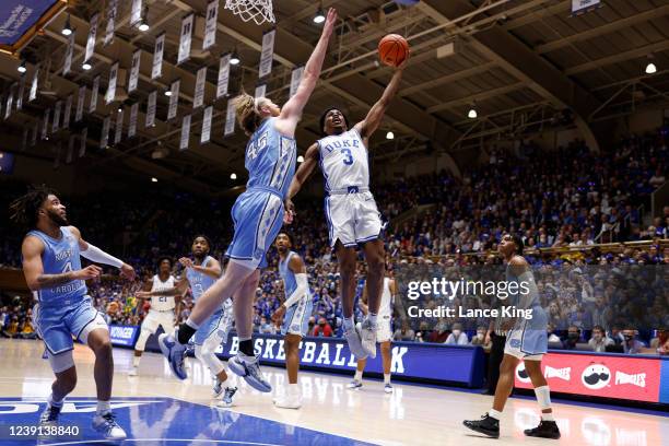 Jeremy Roach of the Duke Blue Devils goes to the basket against Brady Manek of the North Carolina Tar Heels at Cameron Indoor Stadium on March 5,...