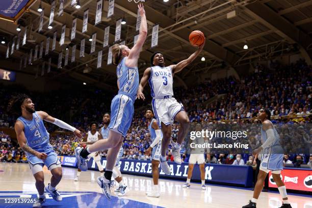 Jeremy Roach of the Duke Blue Devils goes to the basket against Brady Manek of the North Carolina Tar Heels at Cameron Indoor Stadium on March 5,...