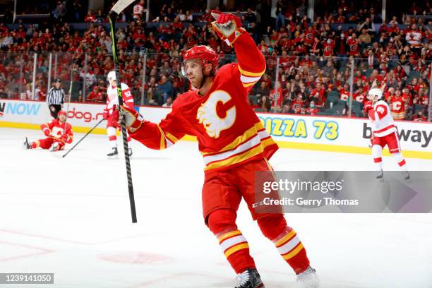 Elias Lindholm of the Calgary Flames celebrate a goal against the Detroit Red Wings at Scotiabank Saddledome on March 12, 2022 in Calgary, Alberta.