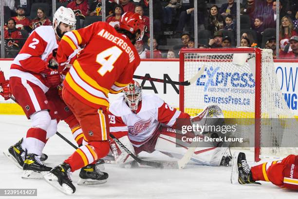 Rasmus Andersson of the Calgary Flames takes a shot on the net of Thomas Greiss of the Detroit Red Wings during an NHL game at Scotiabank Saddledome...