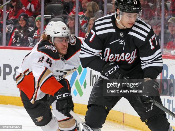 Max Comtois of the Anaheim Ducks skates against Yegor Sharangovich of the New Jersey Devils during the second period on March 12, 2022 at the...