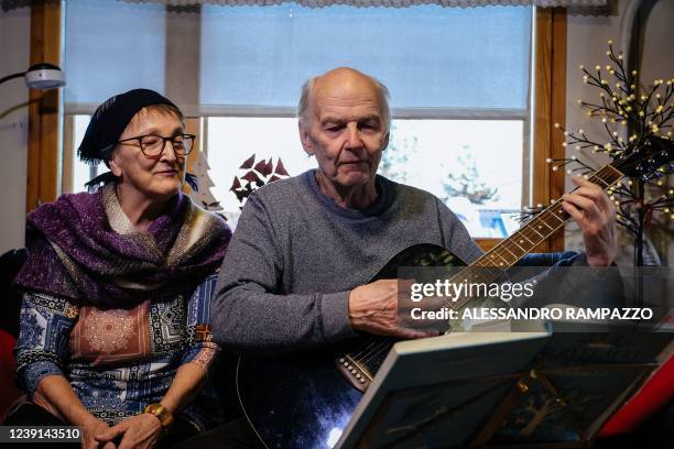 Seppo Laaksovirta and his wife Maija Poyhia sing a traditional song in their home in Lappeenranta, Finland, on March 9, 2022. - In Finland, Russia's...